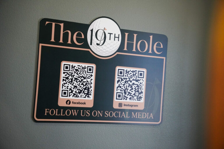 The 19th Hole Follow Us On Social Media wall sign with QR codes, made by Xenix Graphics