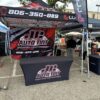 JC Auto Tint event tent, table cover and flags, made by Xenix Graphics