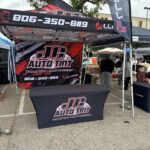 JC Auto Tint event tent, table cover and flags, made by Xenix Graphics