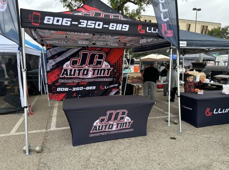 JC Auto Tint event tent, table cover and flags, made by Xenix Graphics