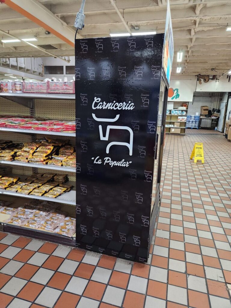 Printed vinyl wrap on a grocery store cooler for a carniceria, by Xenix Graphics