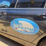 El Paleton oval door magnet on a gray car, made by Xenix Graphics