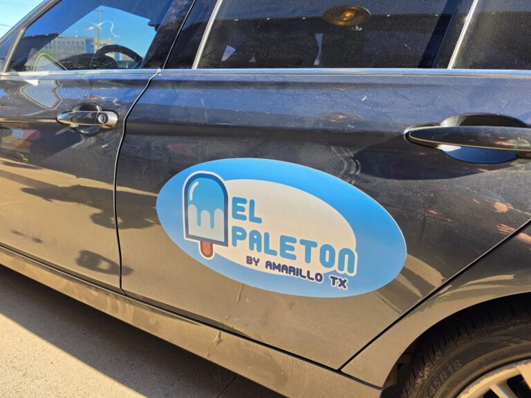 El Paleton oval door magnet on a gray car, made by Xenix Graphics
