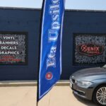 Eta Upsilon feather flag outside the Xenix Graphics shop in Dumas, TX
