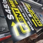 Yellow and black $45/day Rent Me signs by Xenix Graphics