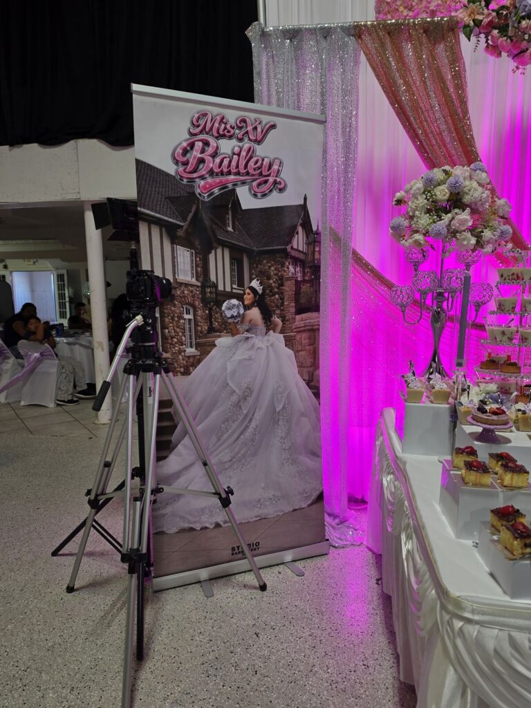 Mis XV Bailey quinceañera retractable banner at an event, printed by Xenix Graphics